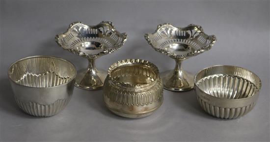 A pair of George V silver pedestal bonbon dishes, two silver sugar bowls and one plated bowl.